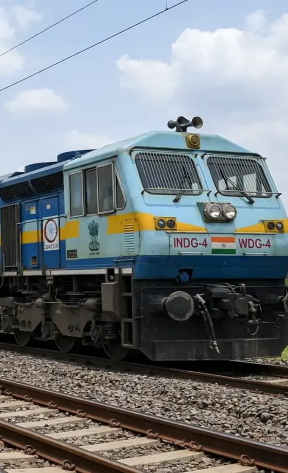 train transporting shipping containers by rail